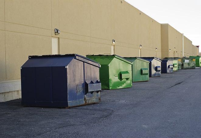 a row of heavy-duty dumpsters ready for use at a construction project in Audubon Park NJ